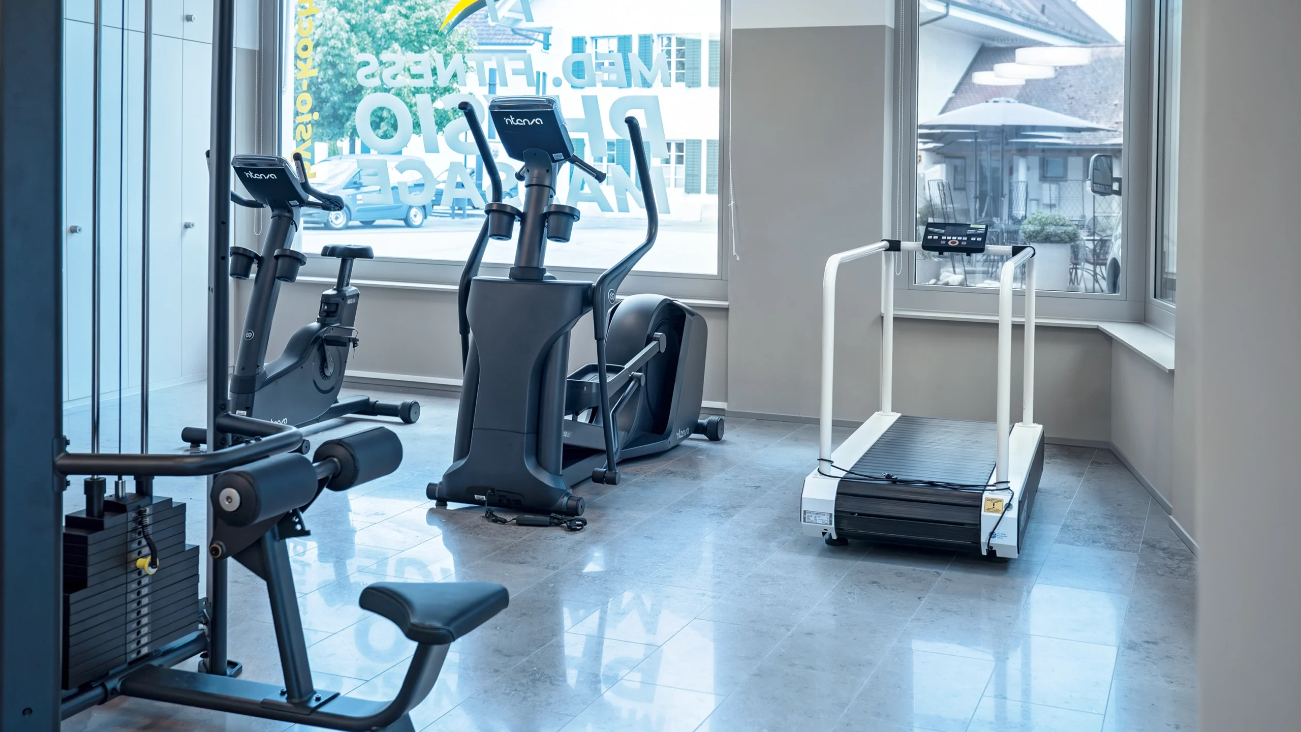 Woman with glasses in front of a group of people